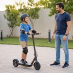 Helmeted 9-year-old practicing a stopped stance on an electric scooter with a parent nearby