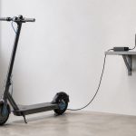 Electric scooter charging safely in a clear dry area