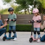 Kids ages 6 to 8 wearing helmets beside small electric scooters with close parent supervision