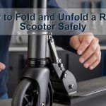 Unbranded folding kick scooter hinge shown open and locked with hands clear