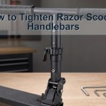 Unbranded kick scooter handlebar clamp spring buttons and correct hand tools on a bench